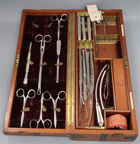 An early 20th century British Army field surgeons set by Arnold & Son, the brass mounted mahogany case enclosing approximately